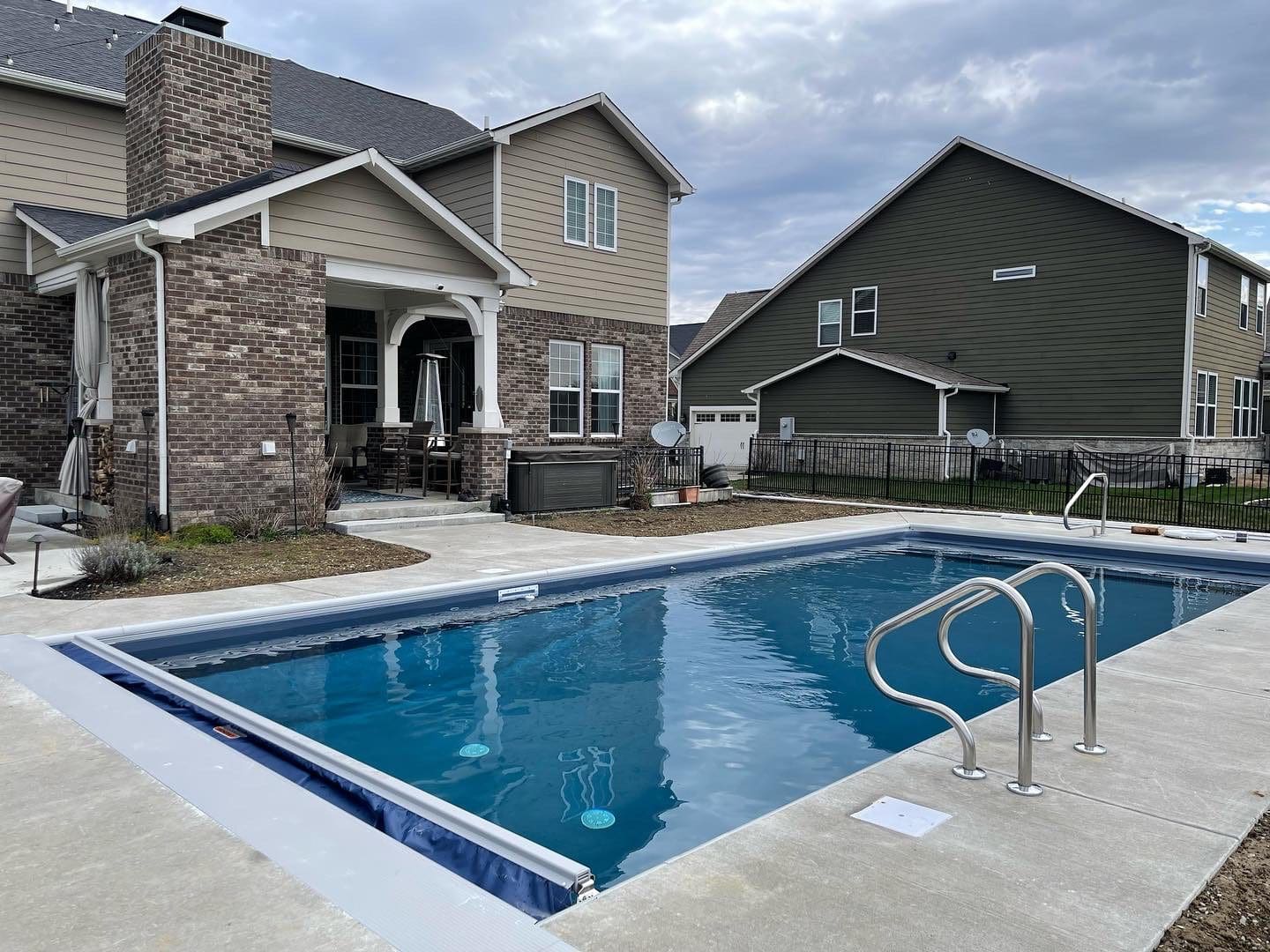 A pool that is in the yard of some kind.